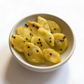 White bowl with passion fruit pieces on a white background