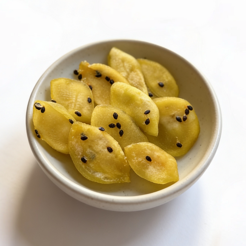 White bowl with passion fruit pieces on a white background